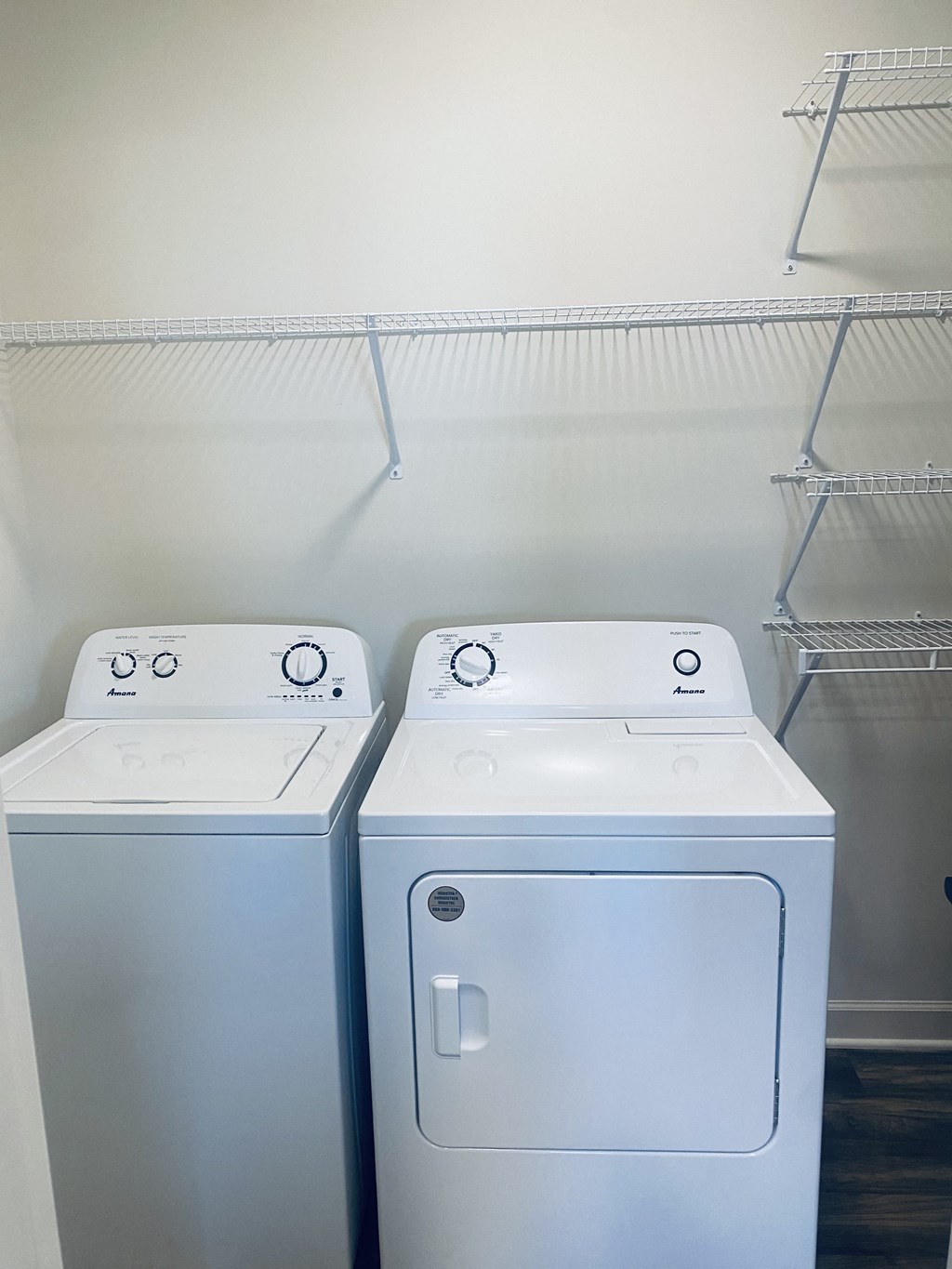 an empty laundry room with two washes and a dryer at Concord Crossing, Lafayette, IN 47909