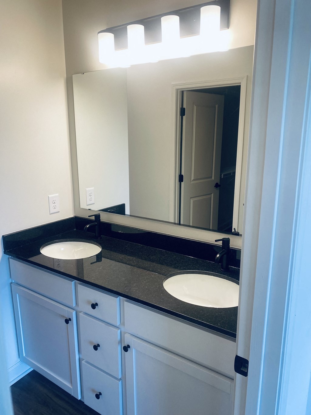 a bathroom with two sinks and a large mirror at Concord Crossing, Lafayette, IN 47909