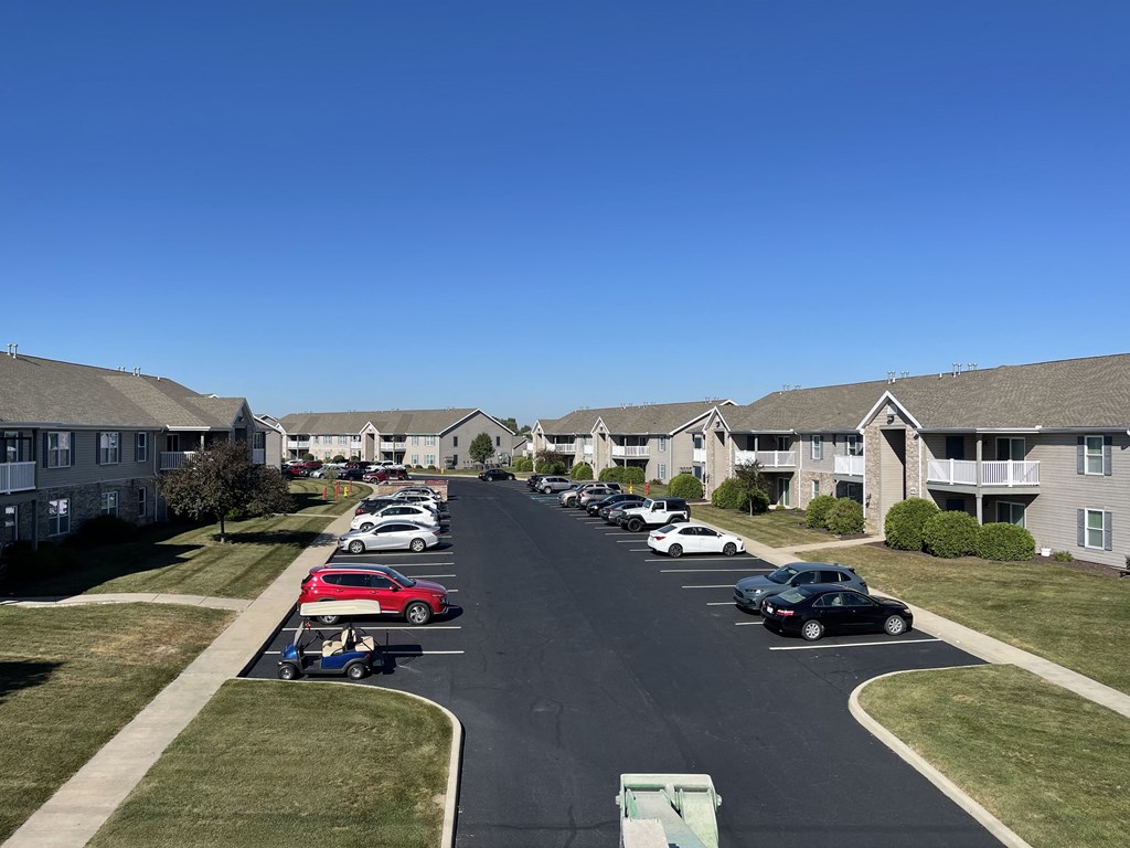 a row of houses with cars parked on a street at Hawthorne Properties in Lafayette, IN 47905
