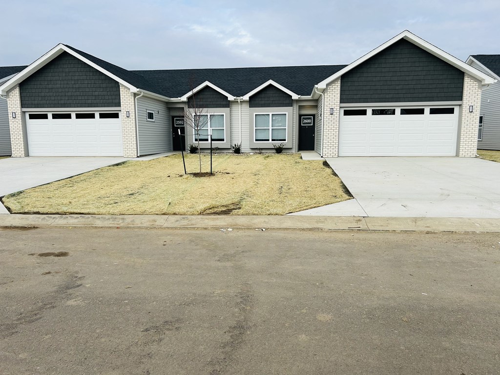 a house with a driveway in front of it at Concord Crossing, Lafayette, IN 47909