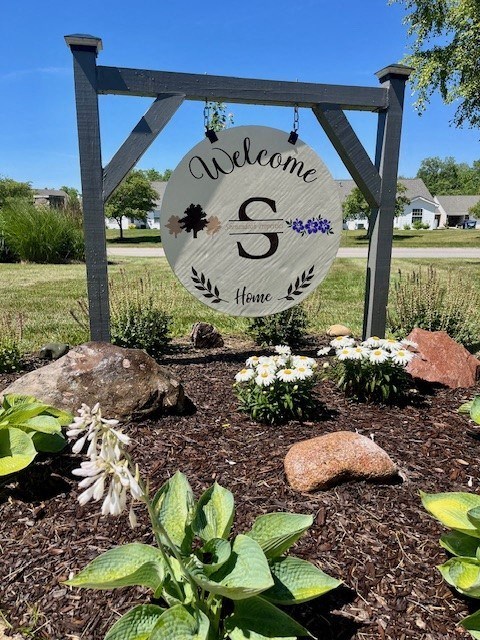 a welcome sign in the front yard of a home at Shenandoah Properties in Lafayette, IN 47905