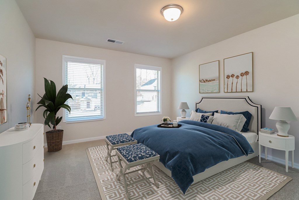 a bedroom with a bed and a dresser and a window