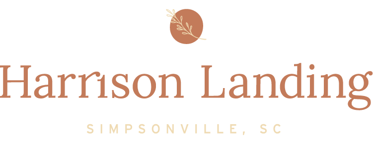 the logo for harrisons landing with a carrot and the word harrison landing