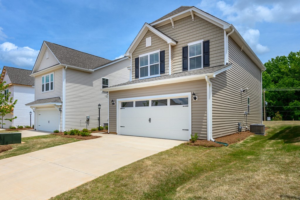 a house with a driveway and a garage door