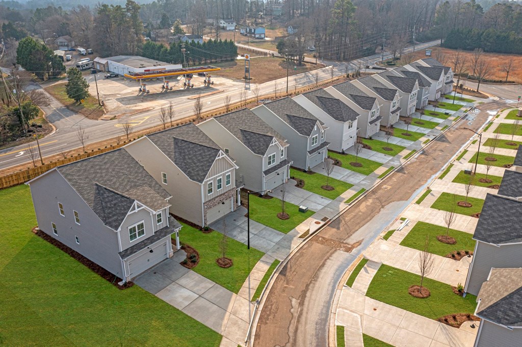 an aerial view of a row of houses on a street