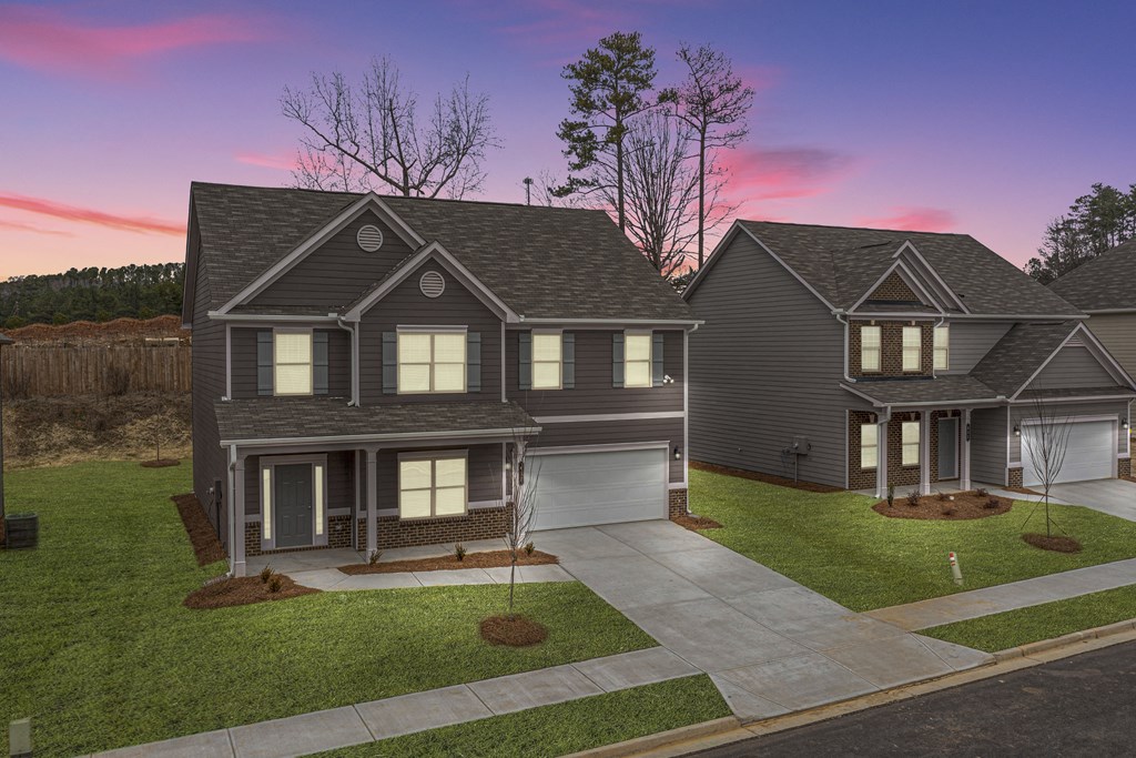 a house with a sunset in the background