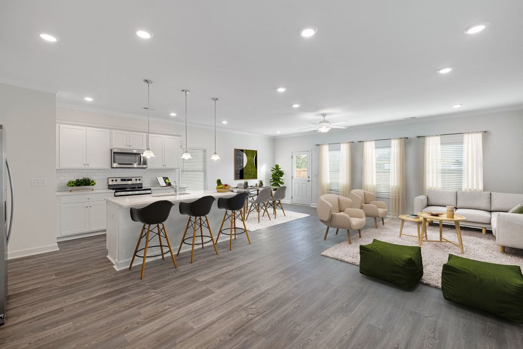 a living room with a kitchen and a dining room
