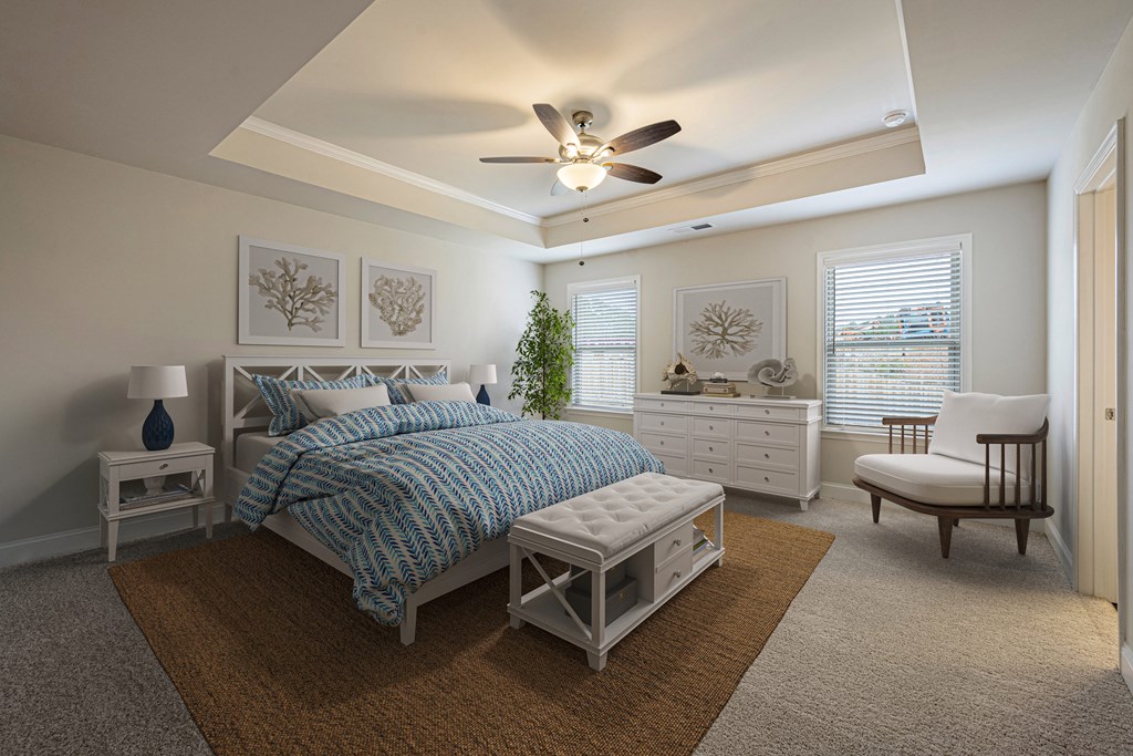 a bedroom with a bed and a ceiling fan