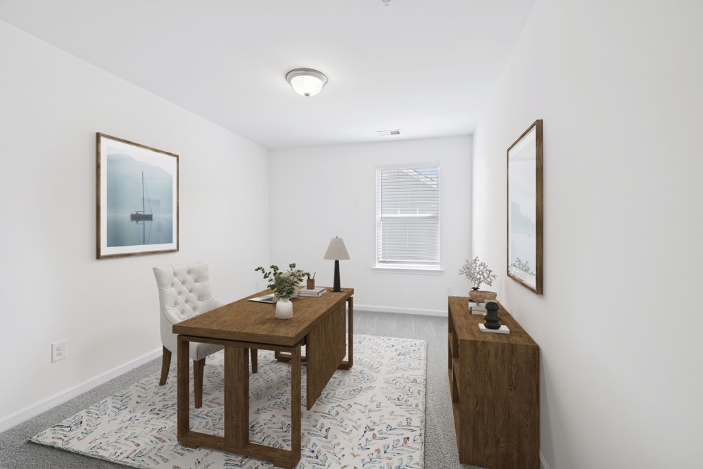 A small table with a chair and a small table with a plant on it.