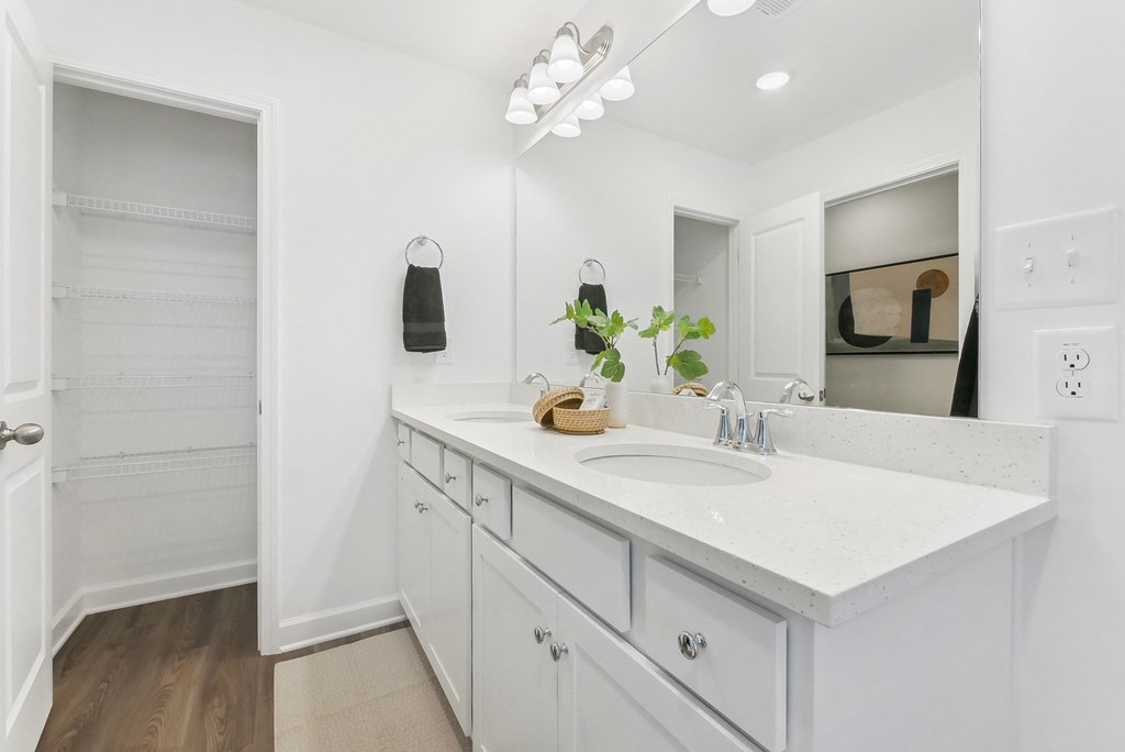 Elegant bathroom featuring double vanity and designer lighting