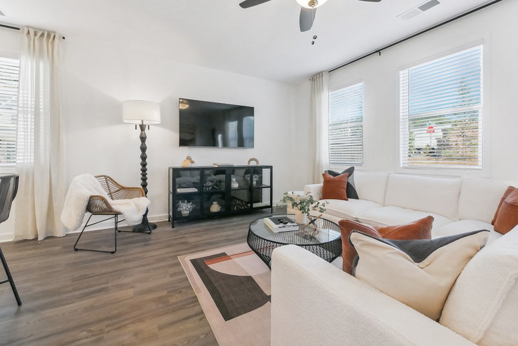 Open-concept living area with cozy fireplace feature