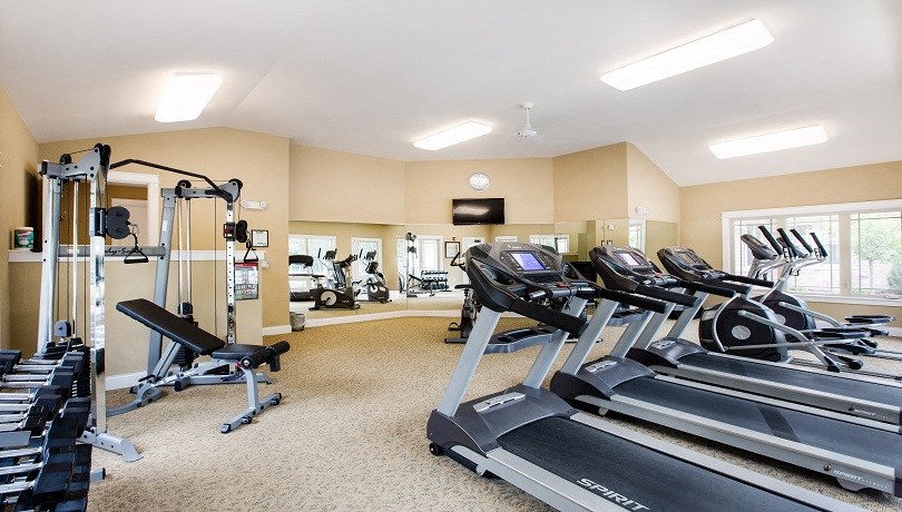 the gym with plenty of cardio equipment at the retreat at thousand oaks apartments
