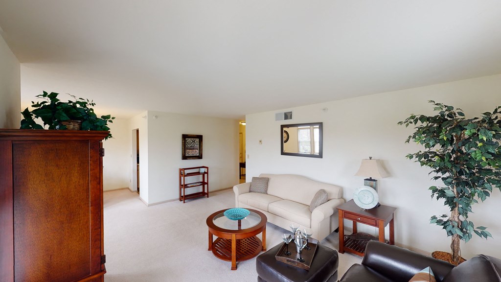 a living room with a couch and a chair