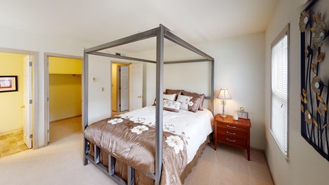 a bedroom with a bed and a nightstand