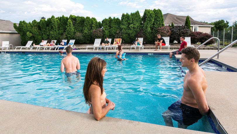a group of people playing in a swimming pool