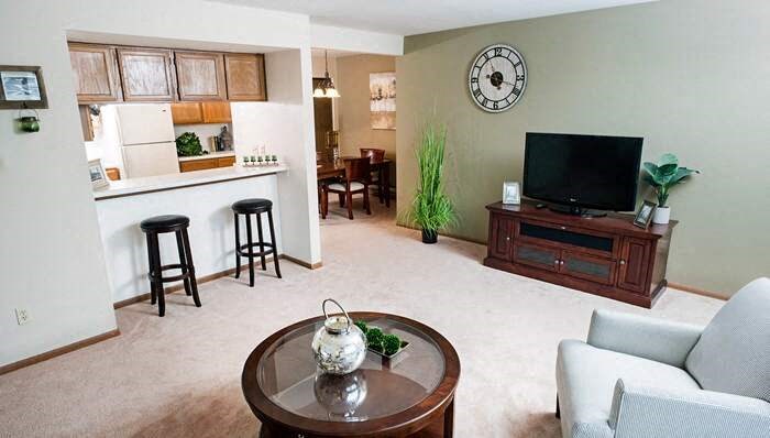 a living room with a table and a television