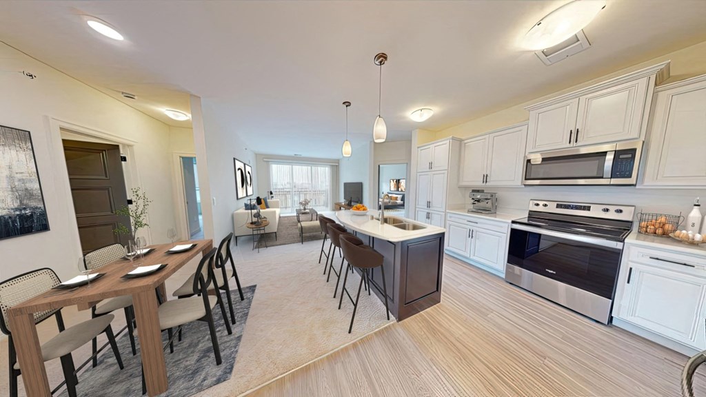 a kitchen and dining room with a table and chairs