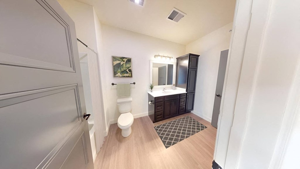 a bathroom with a toilet and a sink