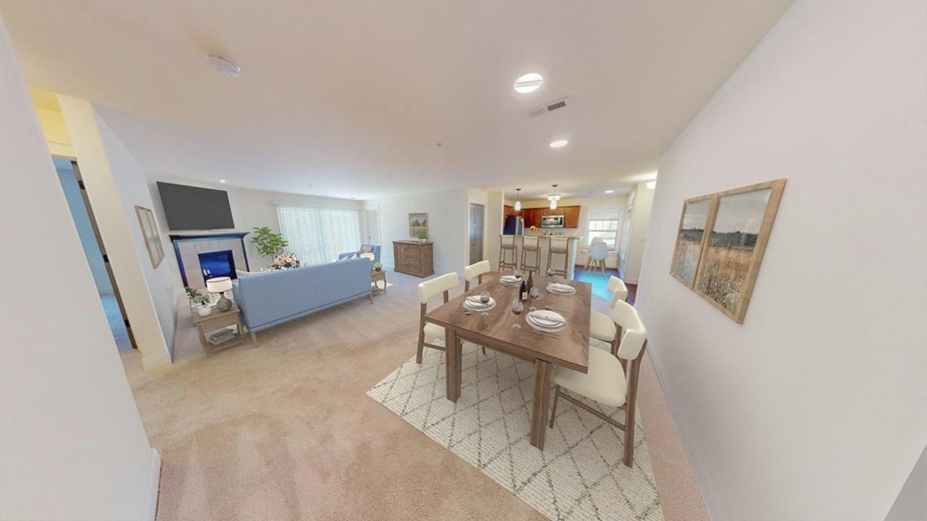 a dining room and living room with a table and chairs