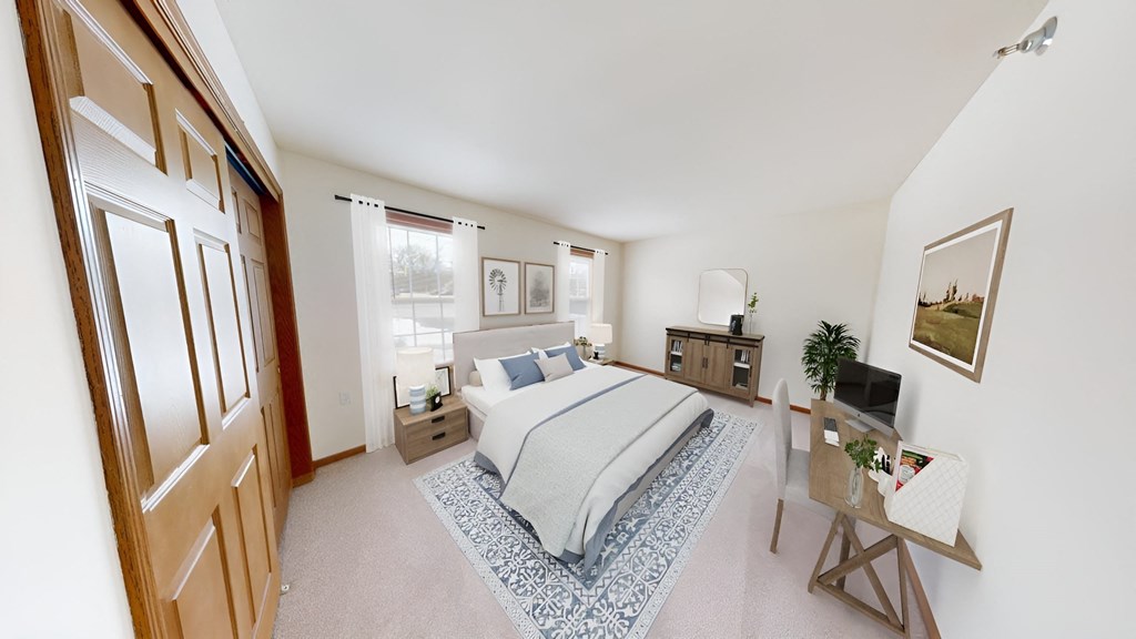 a bedroom with a bed and a door to a bathroom