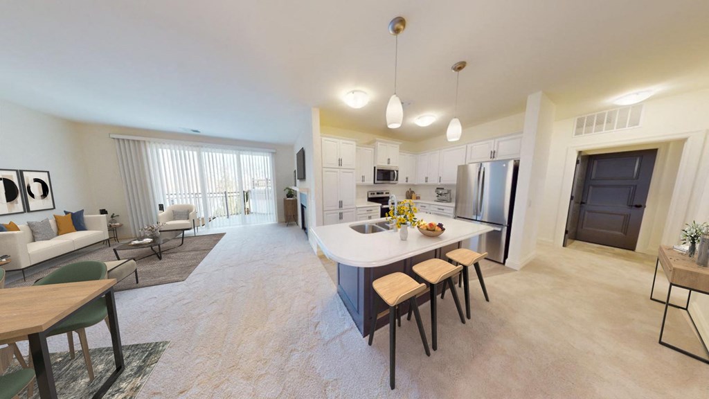 a kitchen and living room with a white counter top