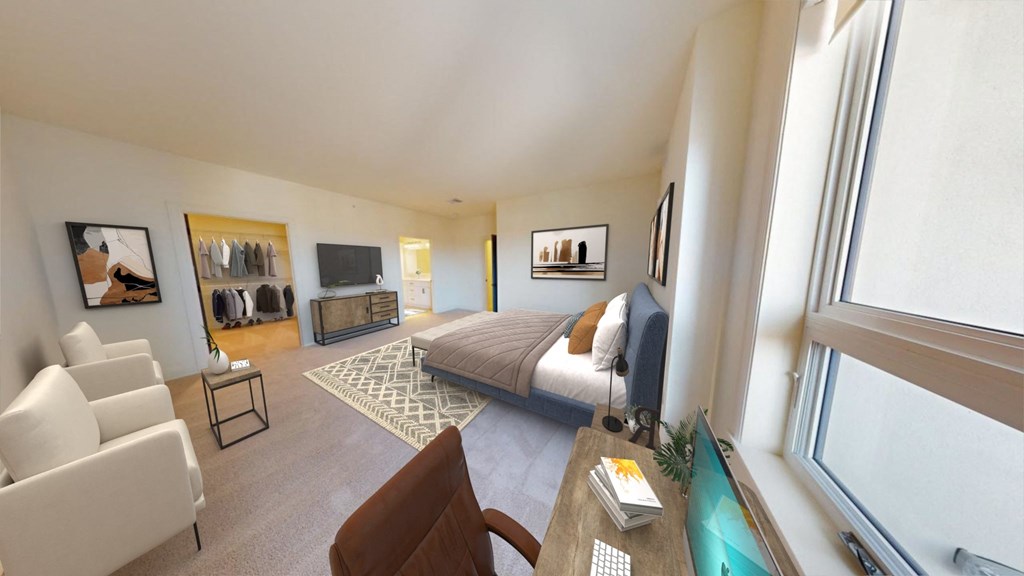 a bedroom with a bed and a couch in a hotel room