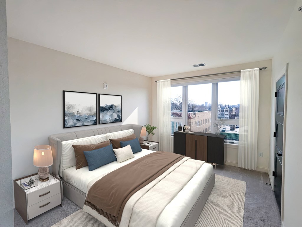 a white bedroom with a large bed and a large window