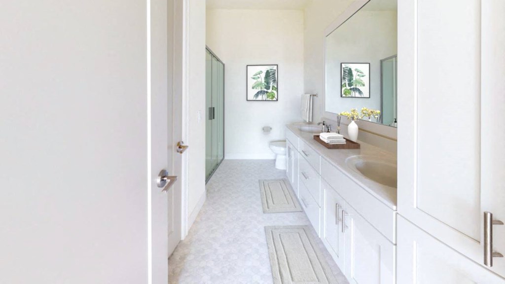 A bathroom with a white door and a white sink.