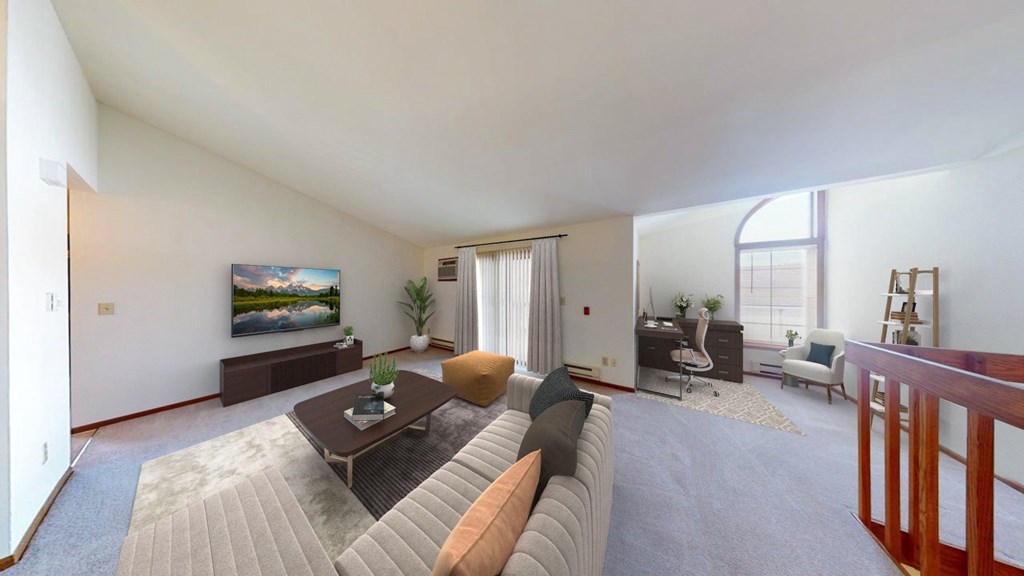 A living room with a couch, a coffee table, and a painting on the wall.