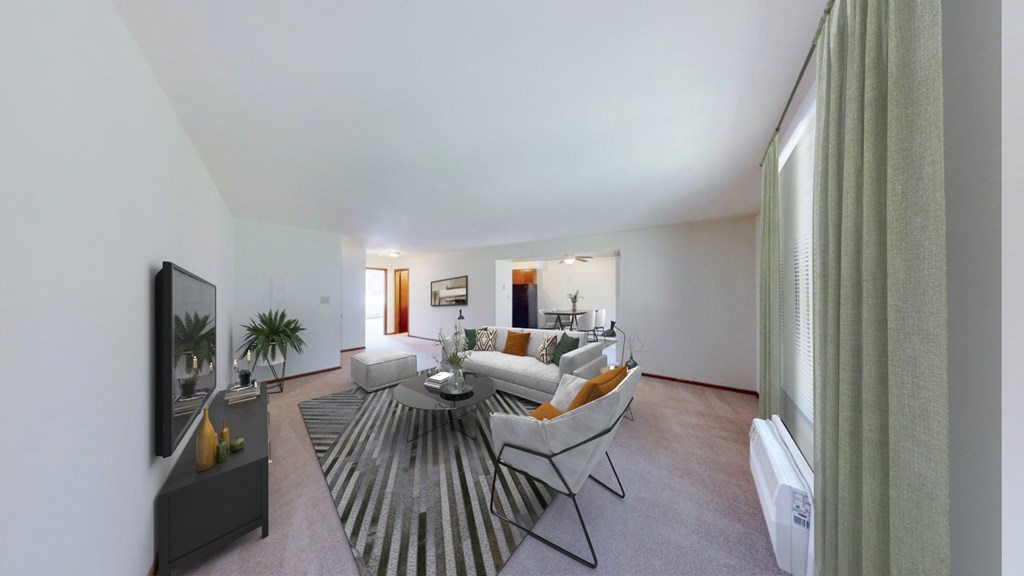 A living room with a grey rug and a white sofa.