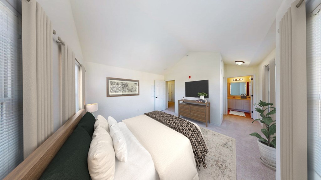 A bedroom with a bed, dresser, and mirror.