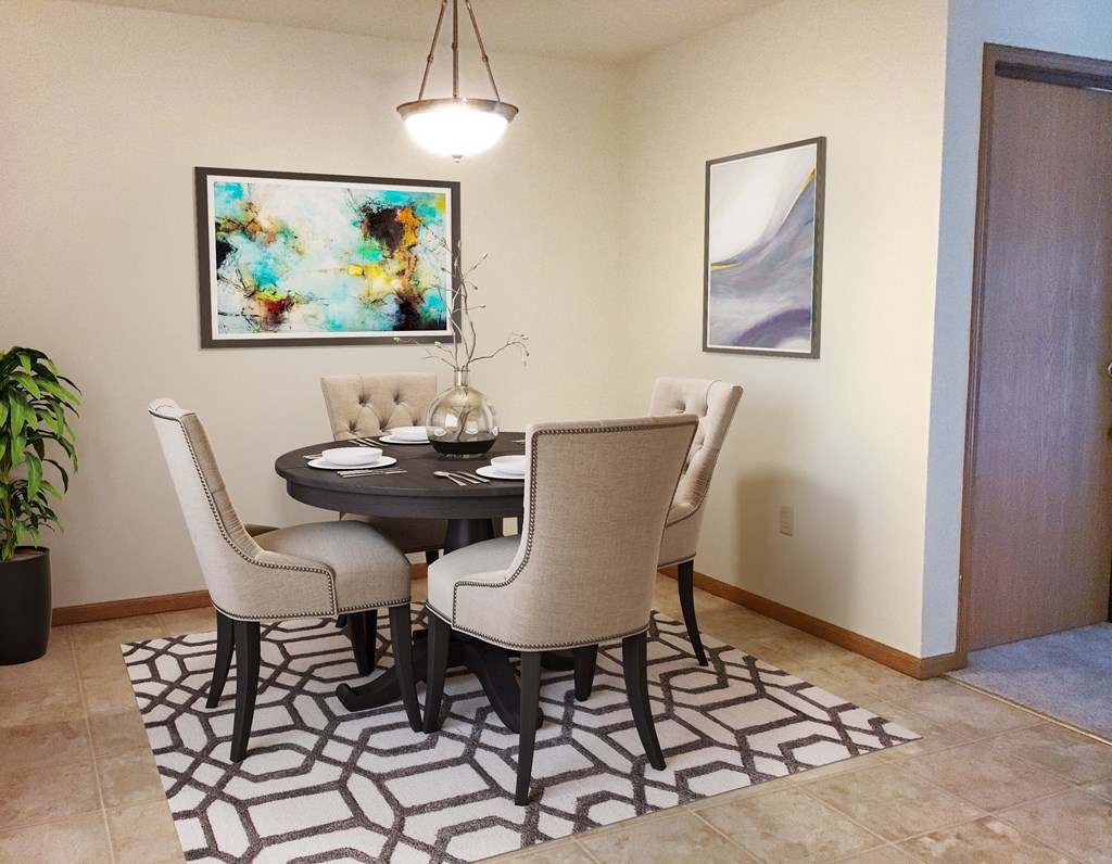 a dining room with a table and chairs