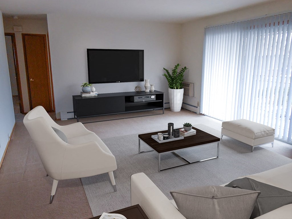a living room with white furniture and a television