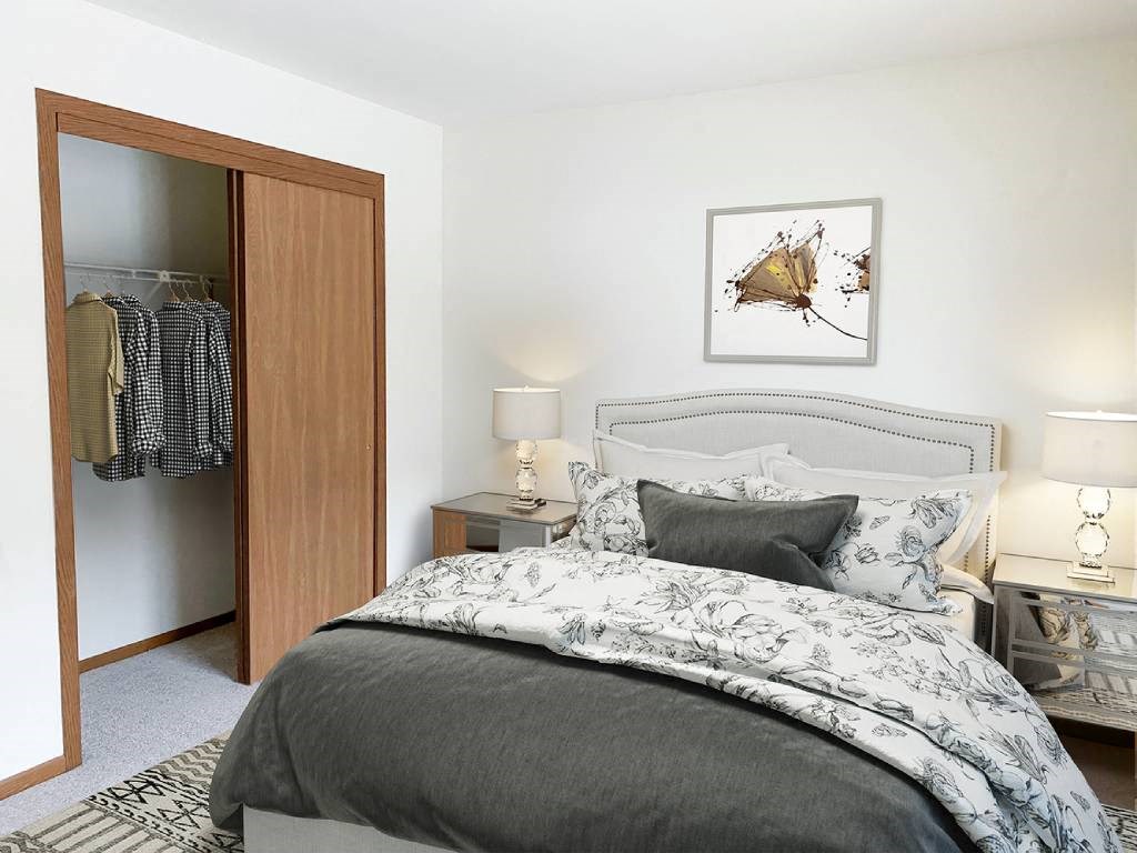 a bedroom with a bed and a closet