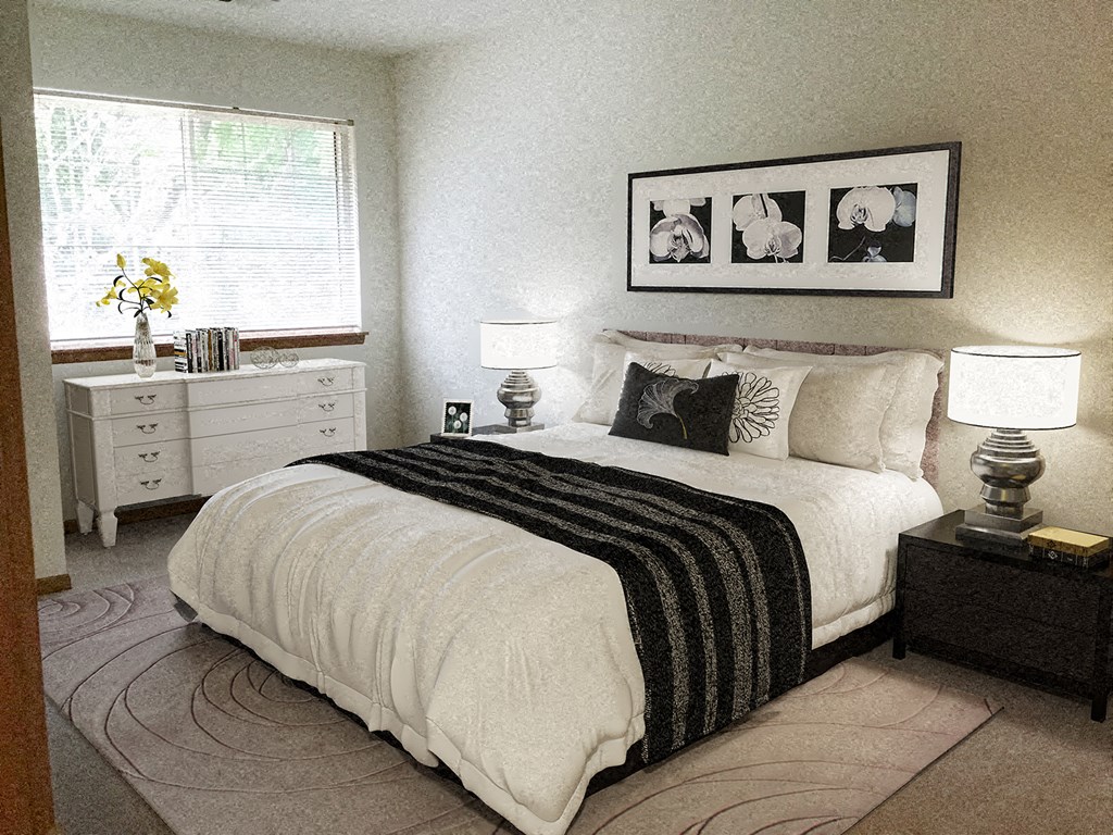 a bedroom with a bed and two night stands