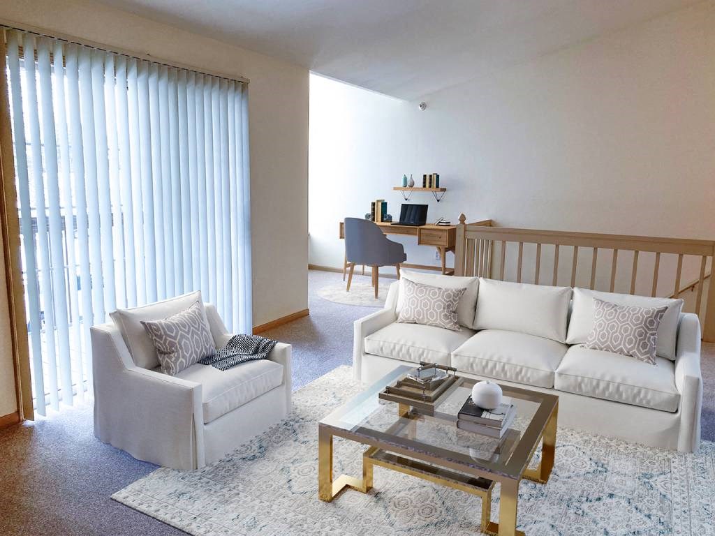 a living room with a couch and a table