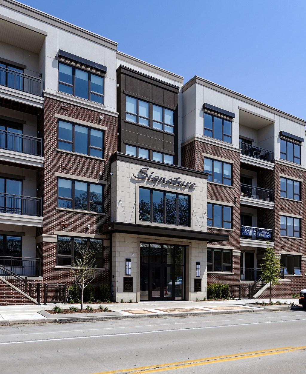 an apartment building on the corner of a street