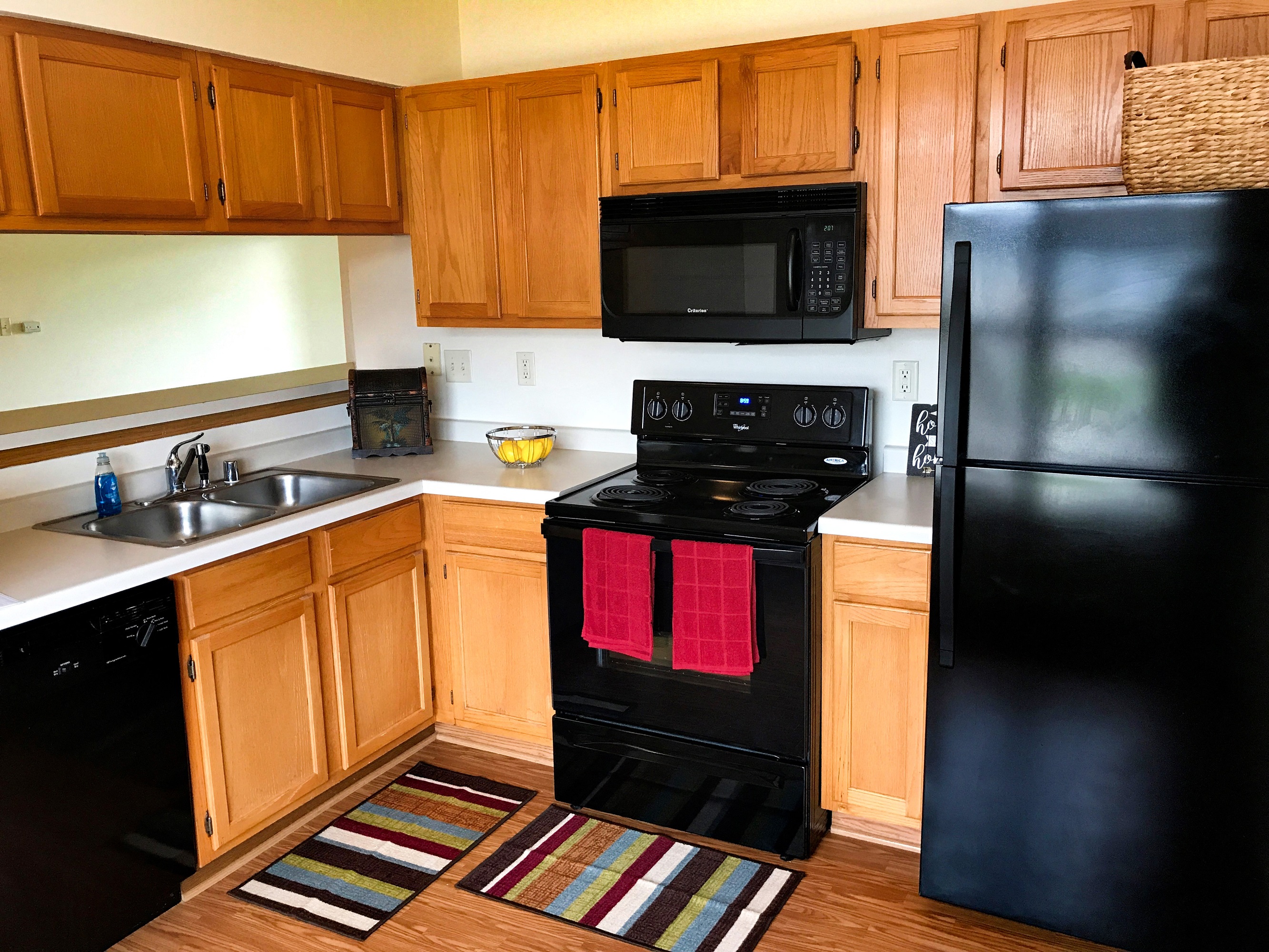 upgraded black kitchen appliances in village green at centennial park