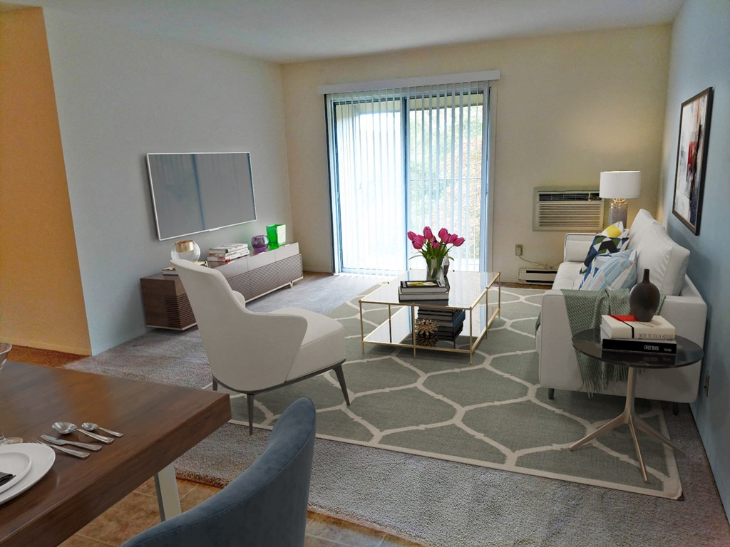 a living room with white furniture and a large window
