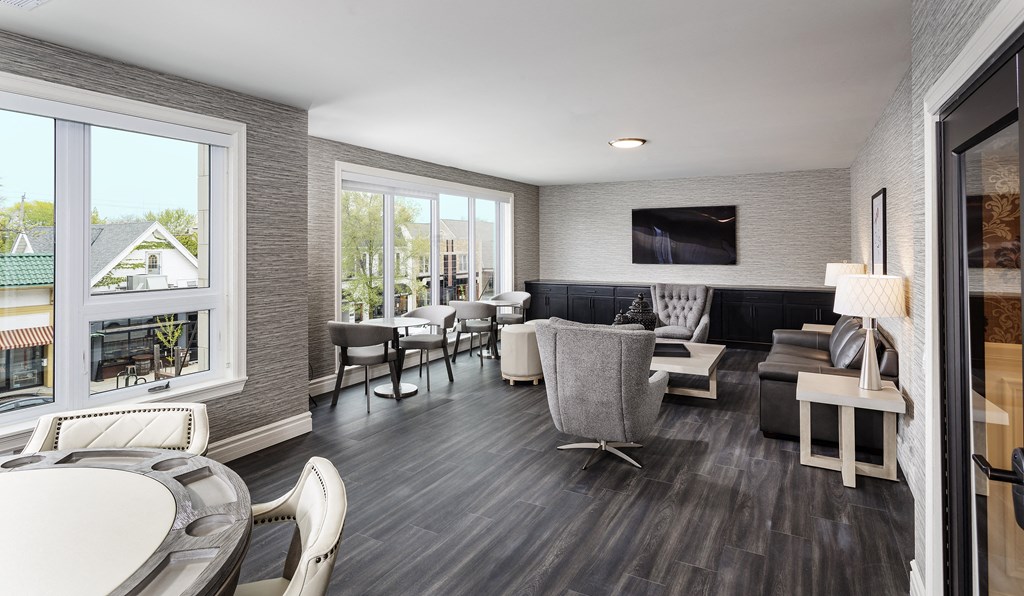 a living room with a table and chairs and a television