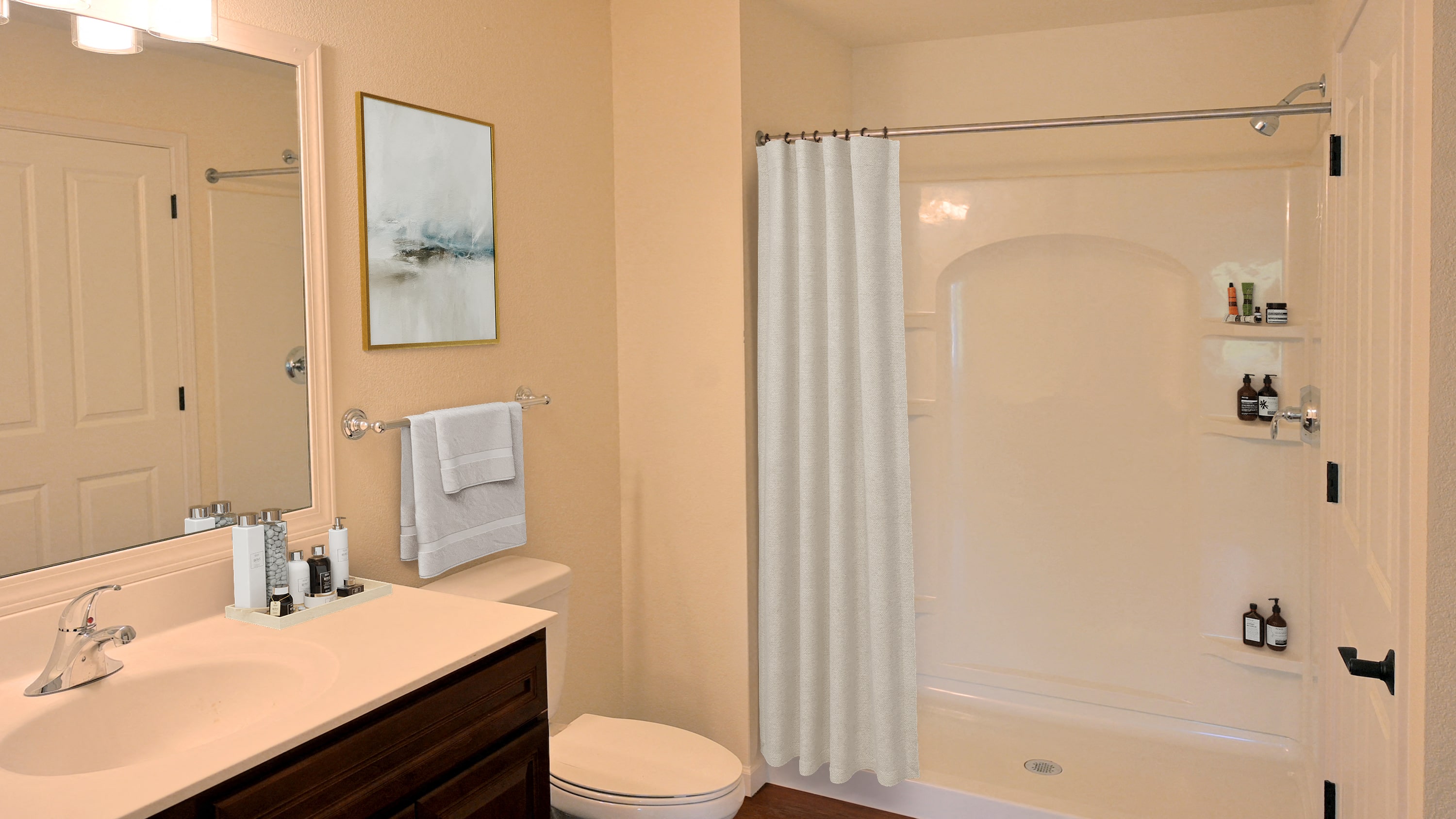 a bathroom with a shower and a sink and a toilet