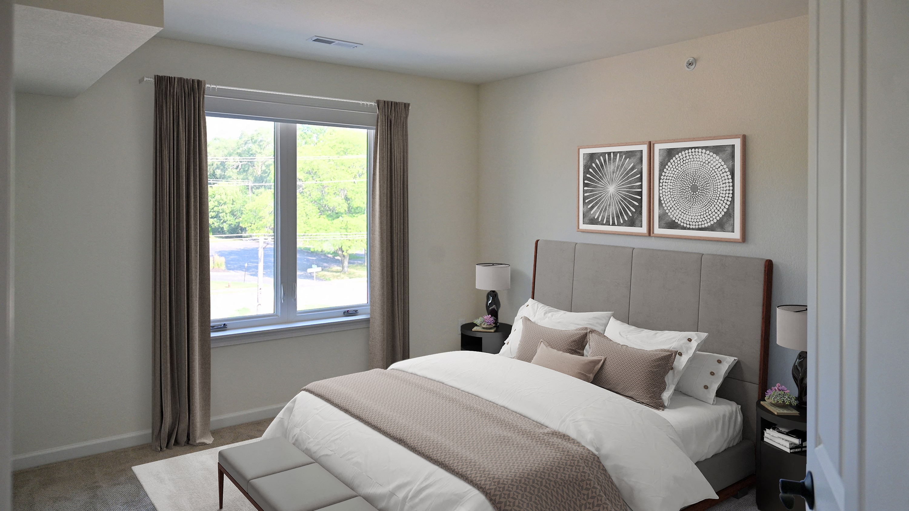 a bedroom with a large bed and a window