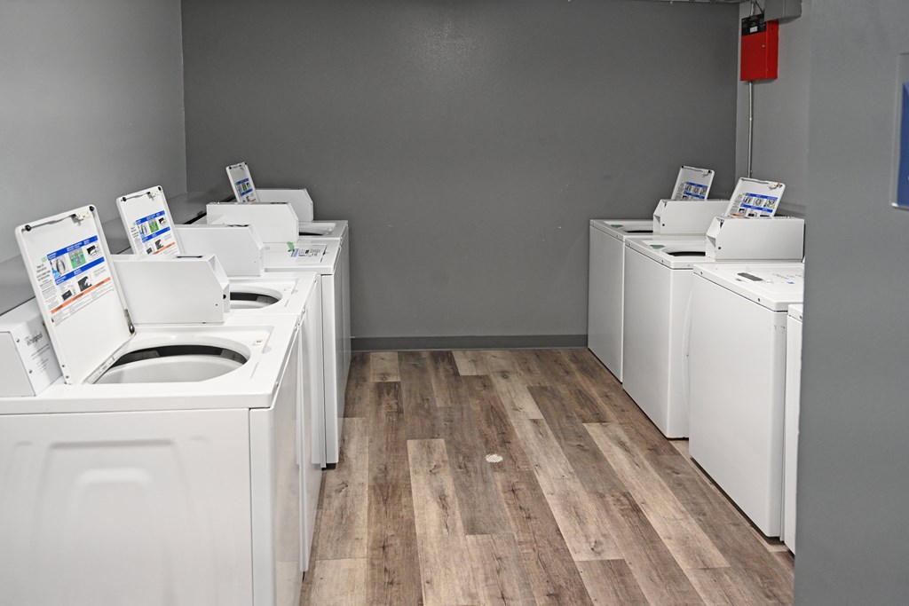 A row of washing machines in a laundromat.