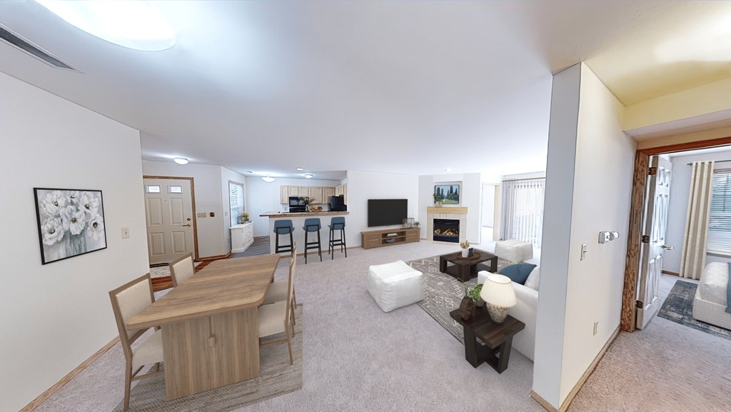 a living room and dining room with a couch and a table