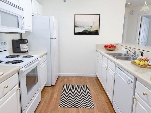 a white kitchen with a black and white rug