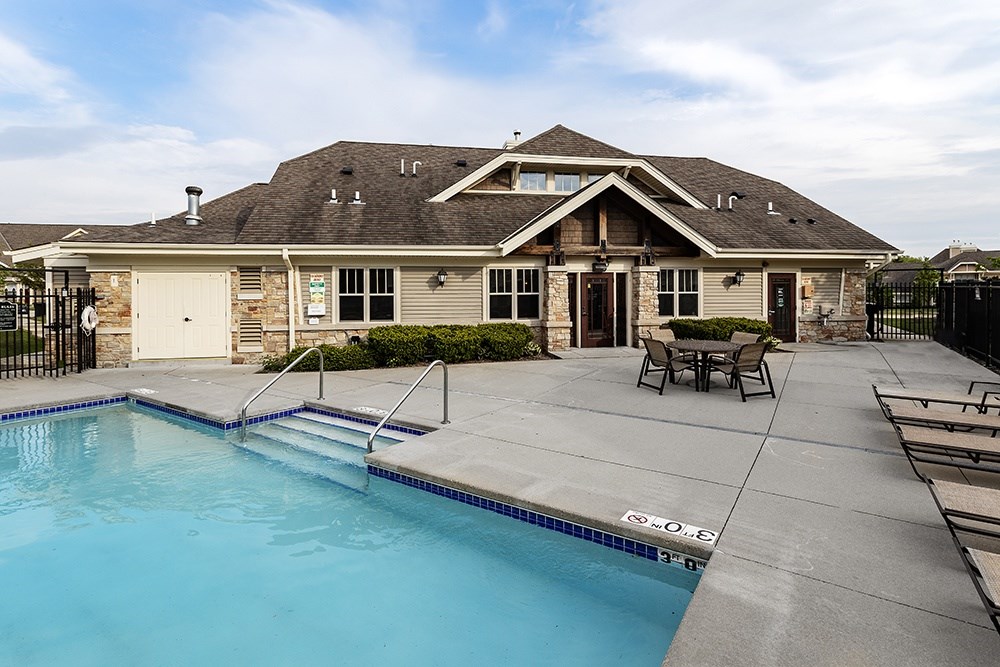 A house with a pool in the backyard.