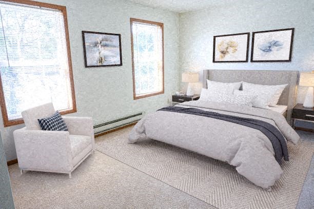 a bedroom with a bed and a chair