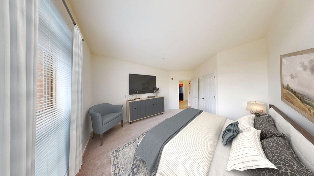 A bedroom with a large bed and a television in the corner.