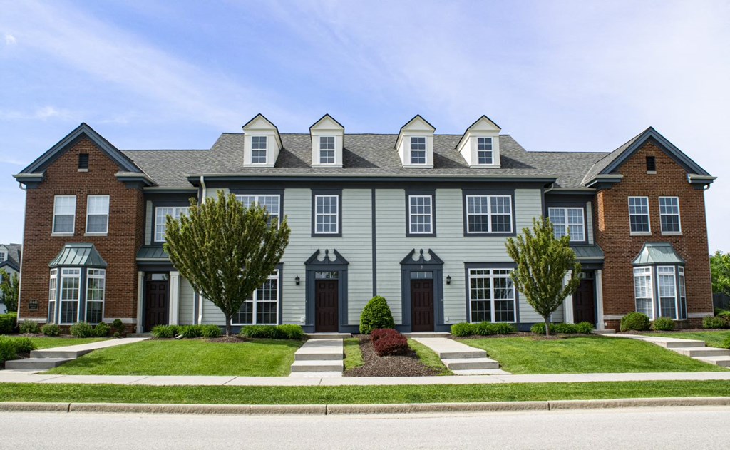 a large house with a street in front of it
