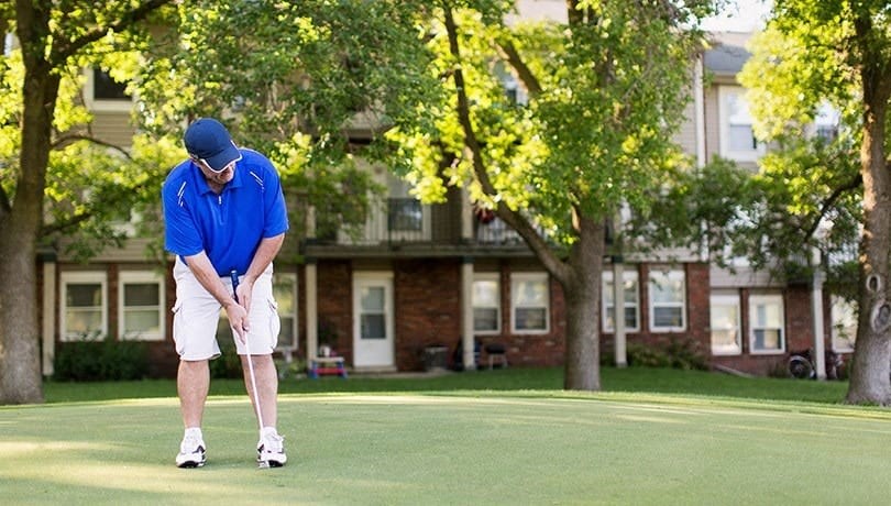 a man is playing golf on a golf course
